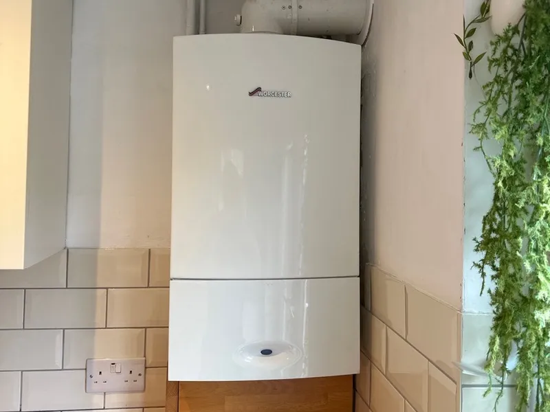Worcester boiler neatly installed above metro tiles in a Kent home